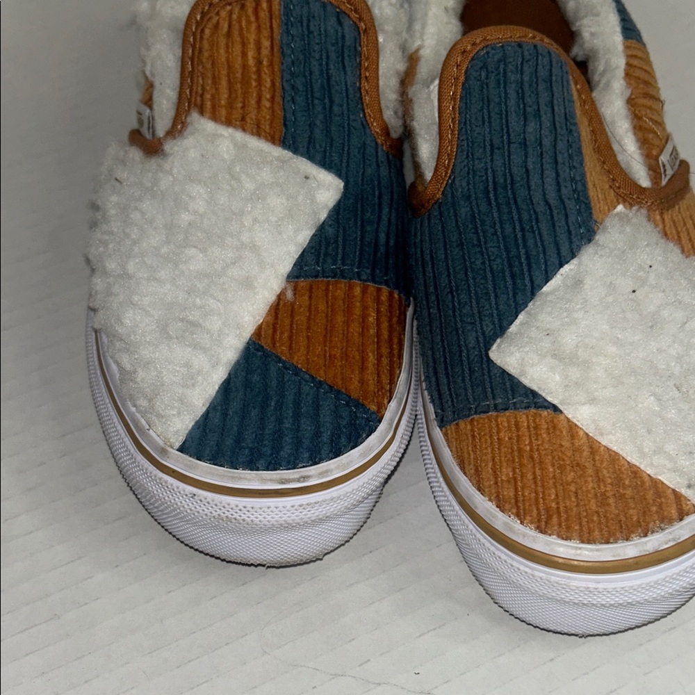 Vans Cozy Sherpa Slip-Ons in Blue, White, and Tan